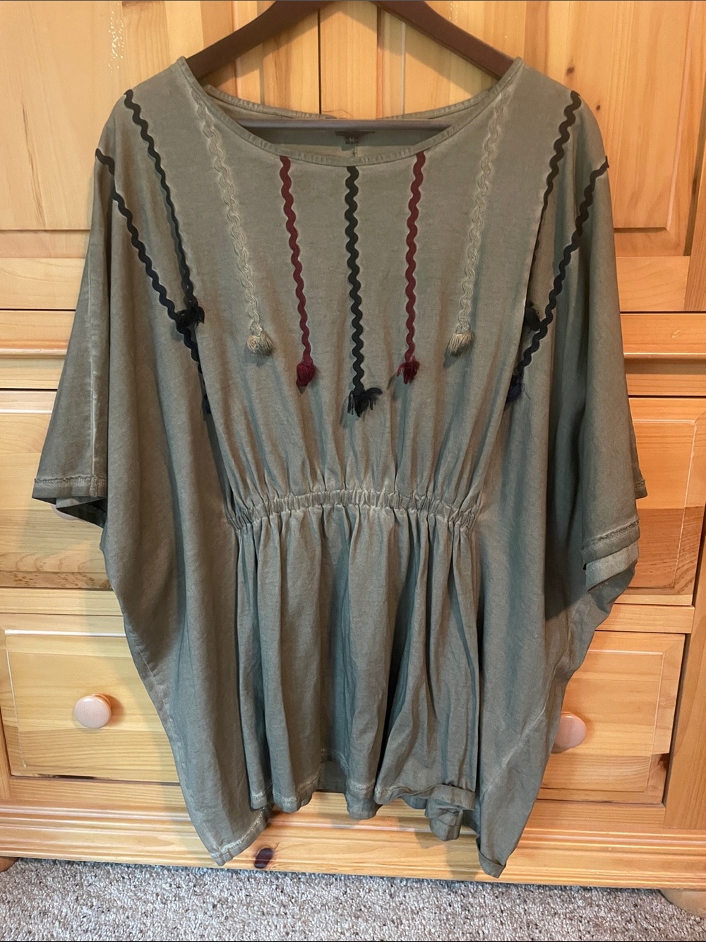 NWOT POL Olive Boho elastic waist poncho Top with Tassel Trim